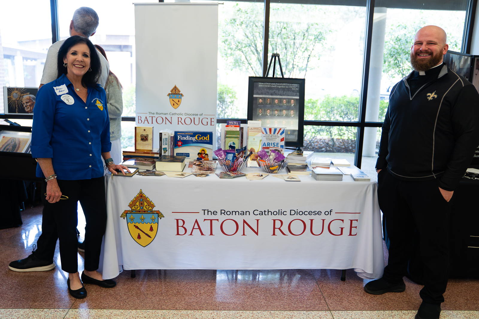 Diocese of Baton Rouge exhibitor table with staff