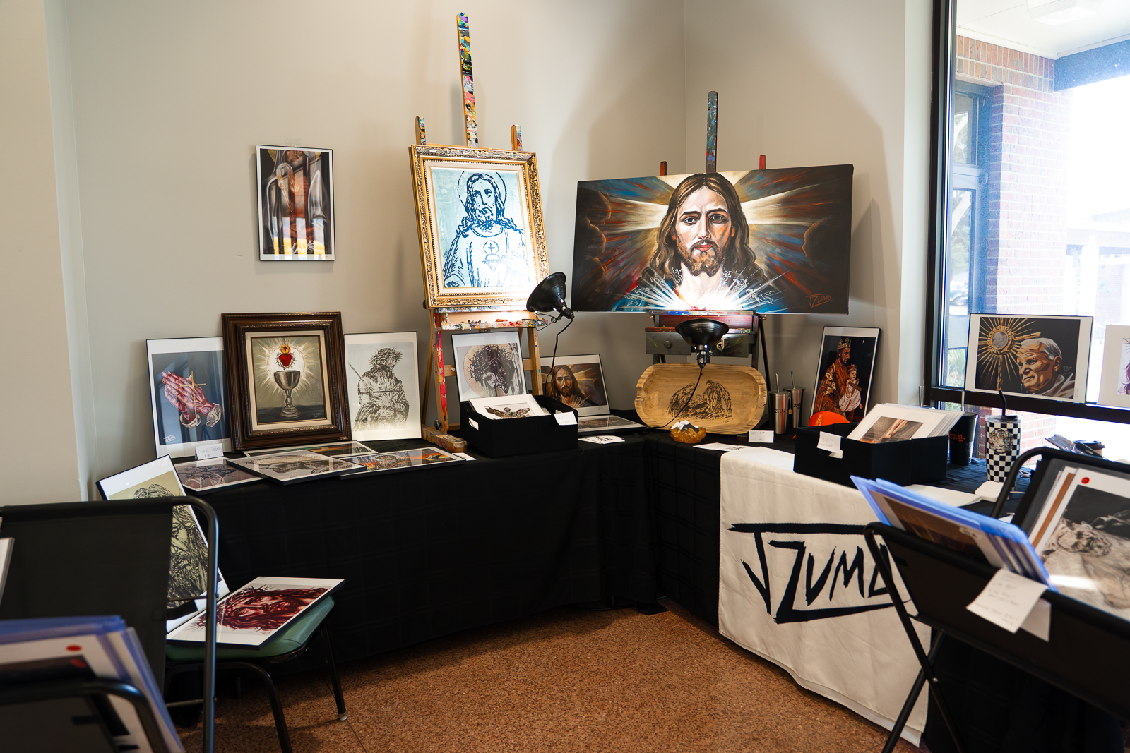 Sacred art display with framed paintings of Christ