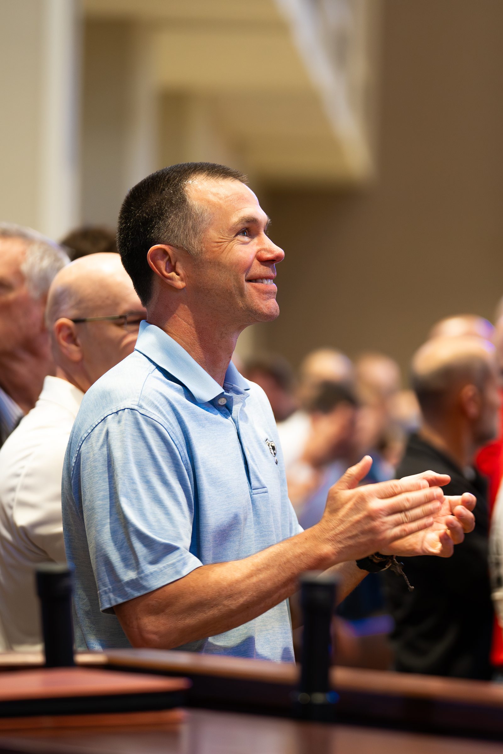 A man applauding during the conference